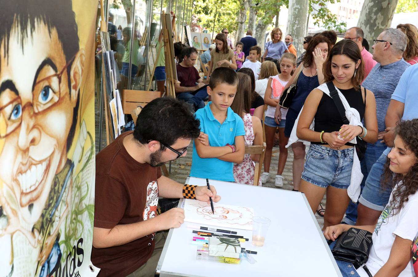 Caricaturistas en el paseo central del Campo Grande