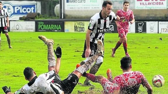 El Guijuelo gana en el barro